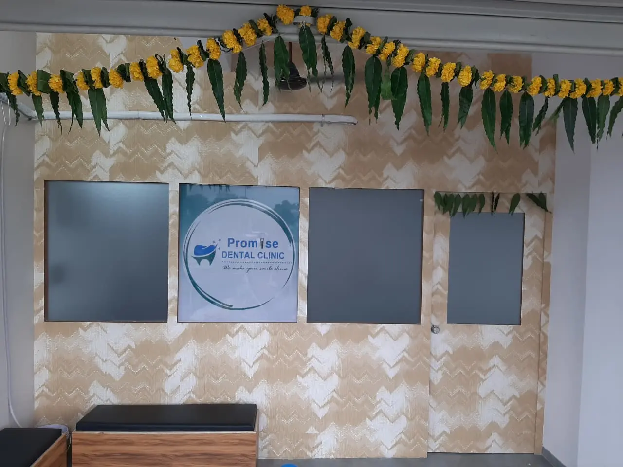Promise Dental Clinic sign displayed inside the clinic.