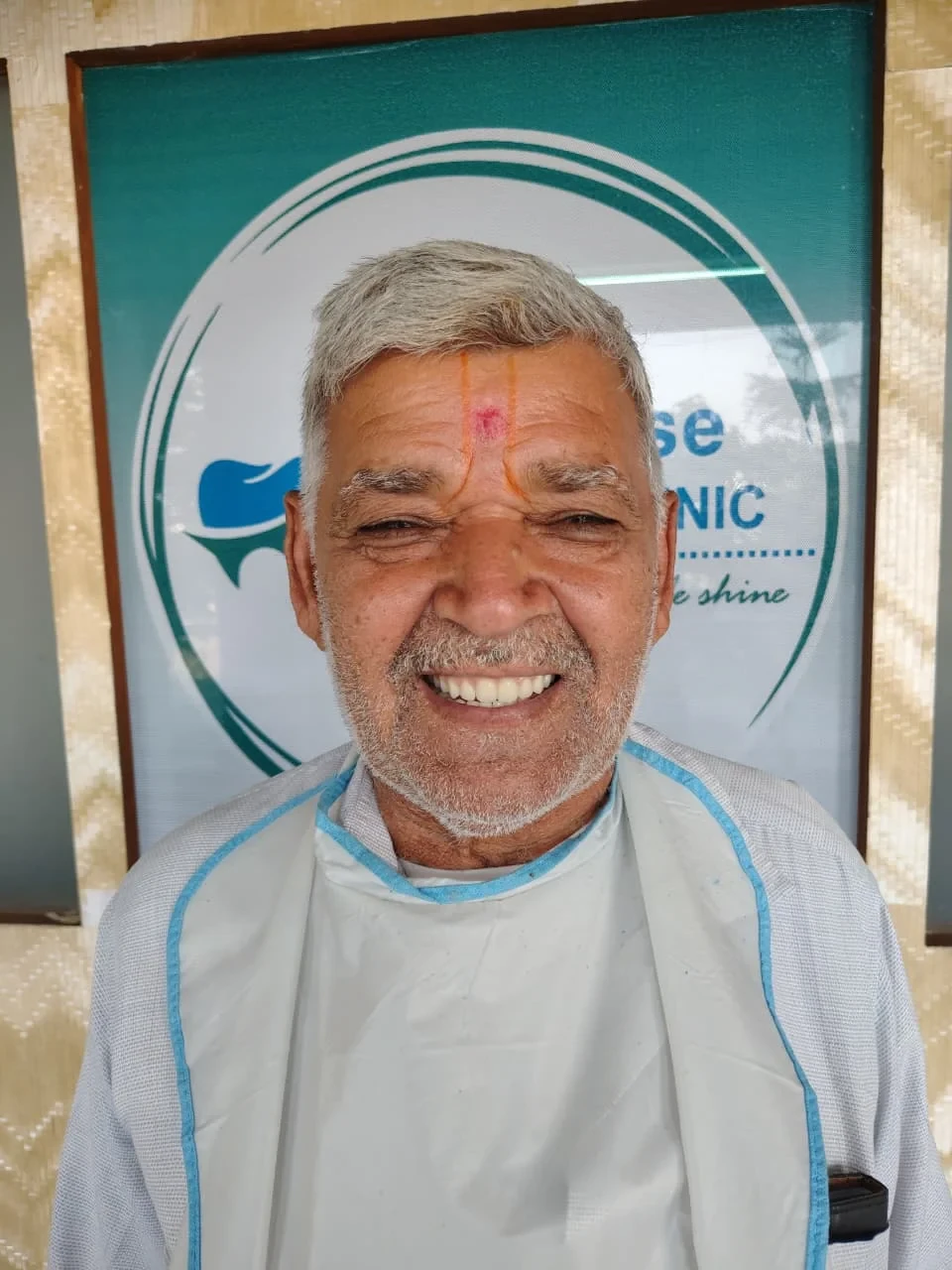 A patient smiling at the clinic.